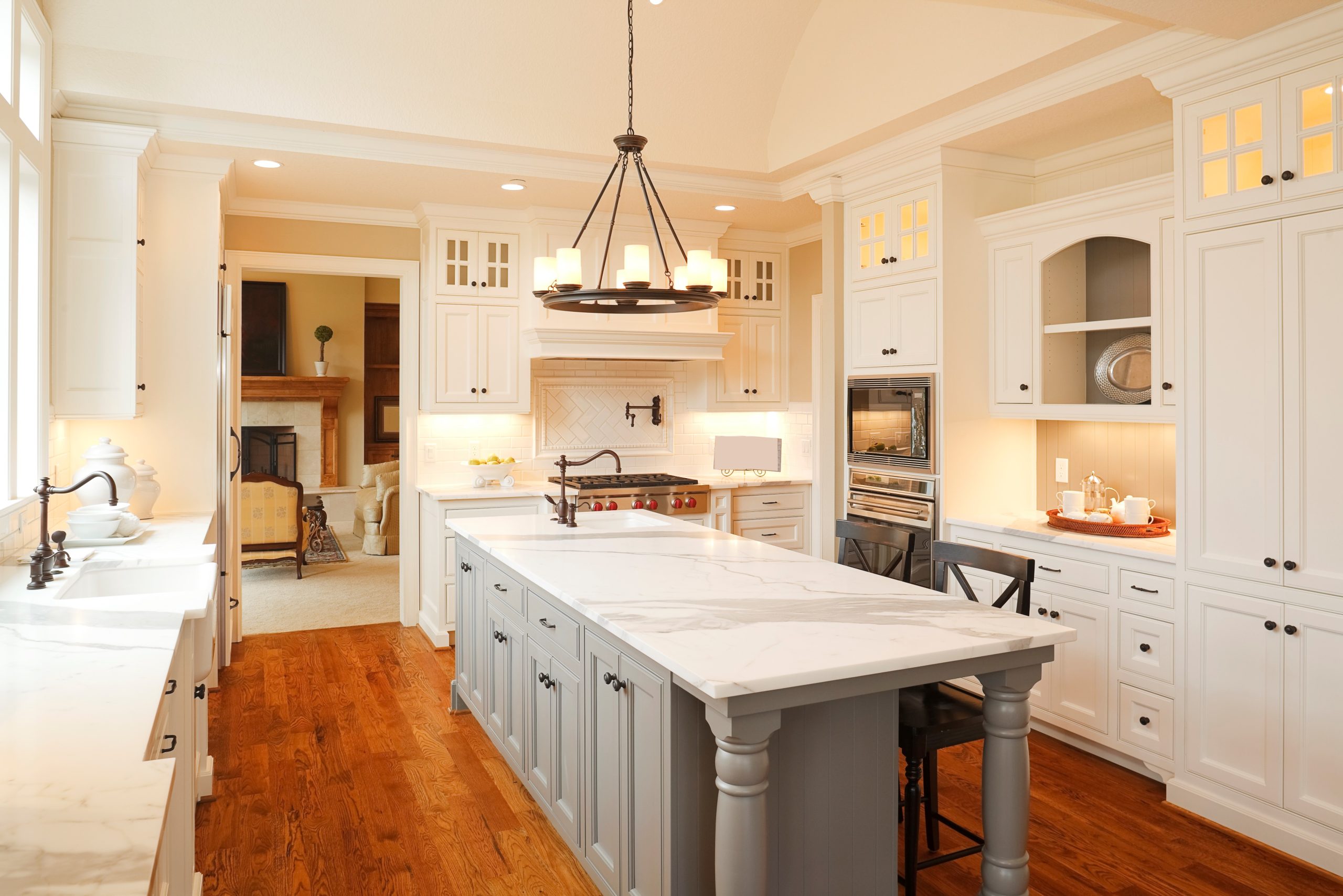 A beautifully finished kitchen with white and gray cabinets